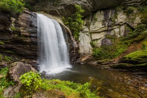 a gorgeous waterfall shown in the summer, near Blowing Rock, NC